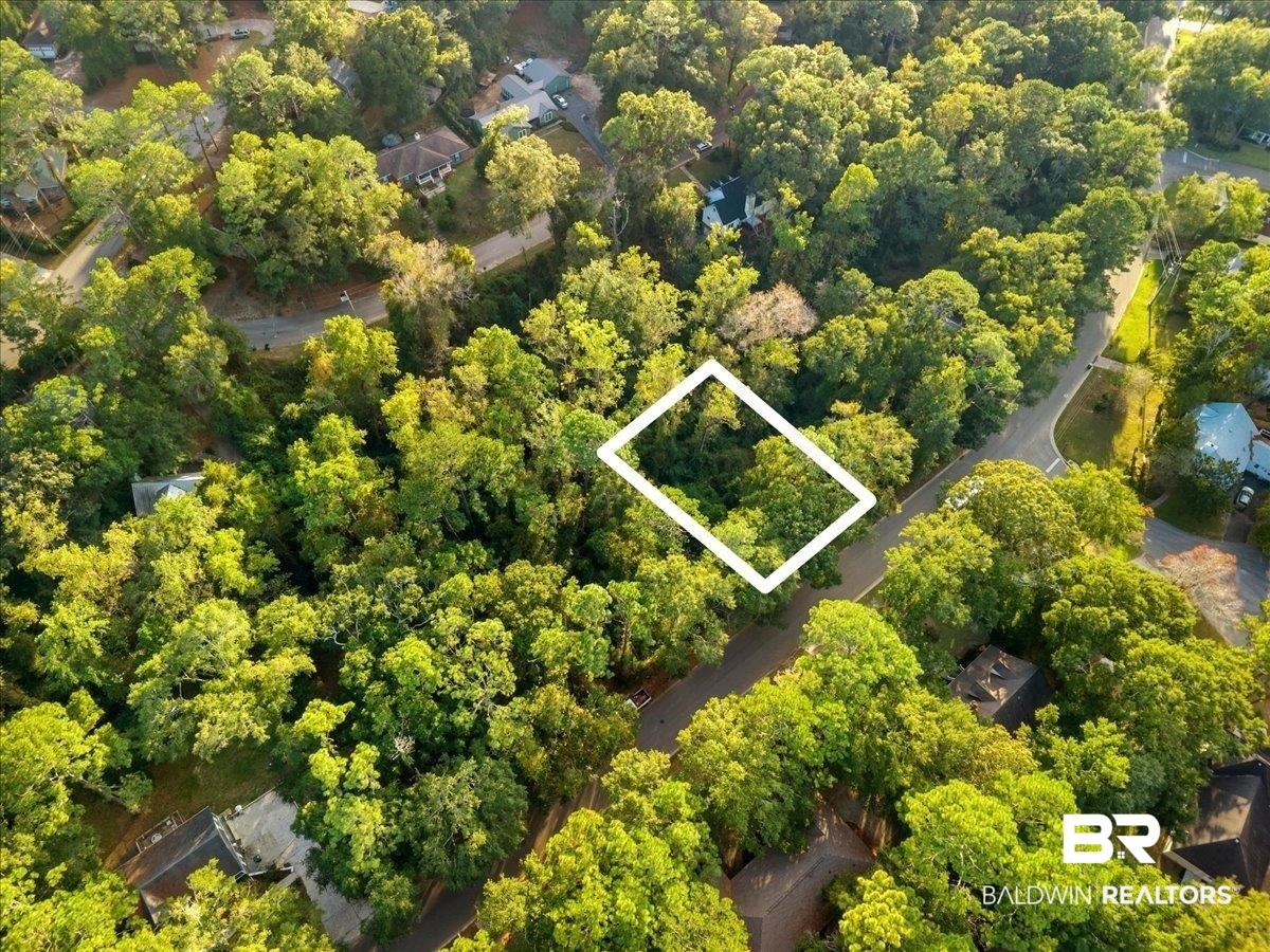 Image 4: View of property location featuring property boundaries highlighted and a heavily wooded area
