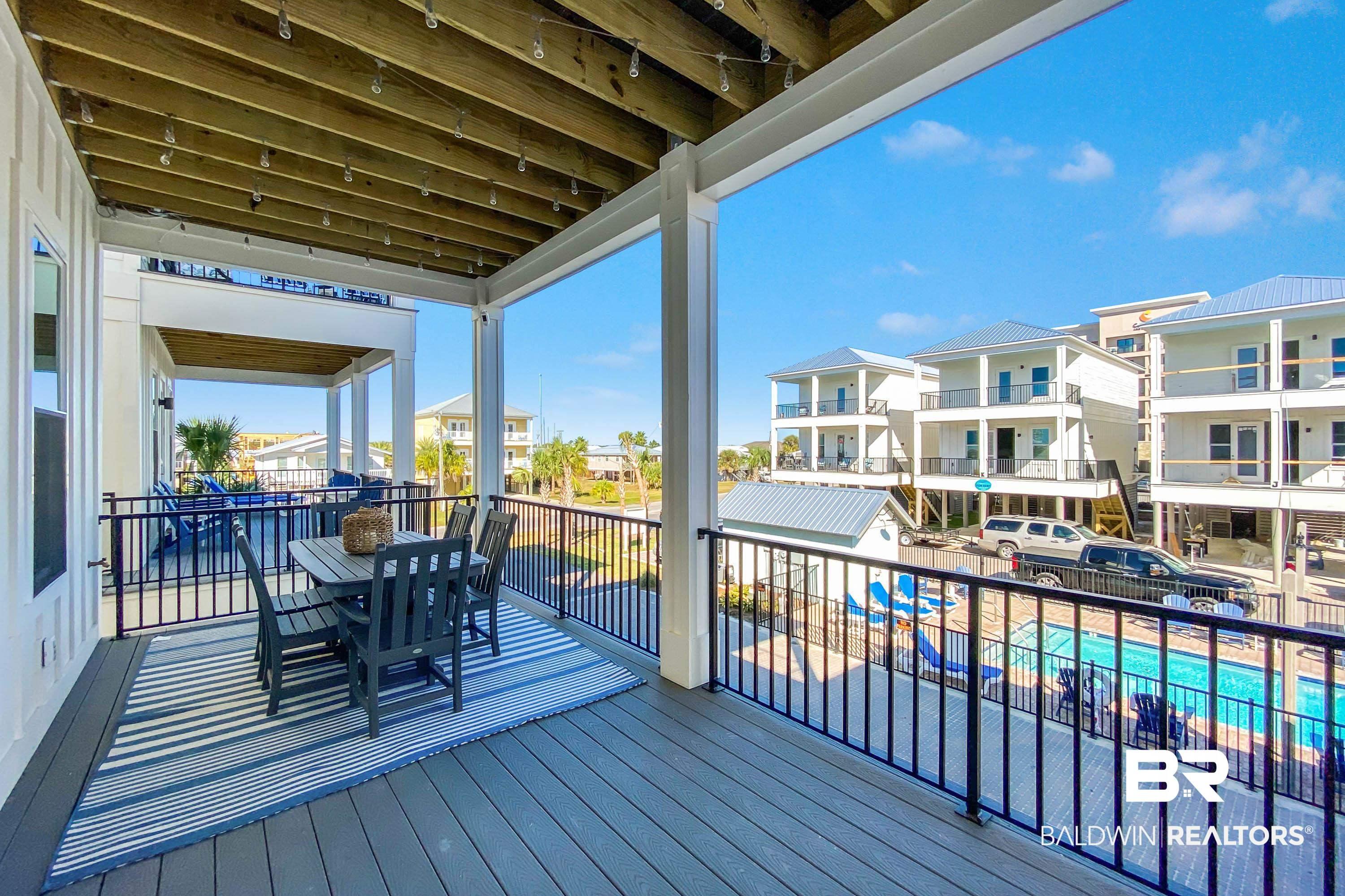 Image 3: Wooden terrace featuring outdoor dining space