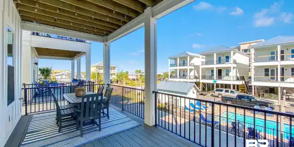 Image 3: Wooden terrace featuring outdoor dining space