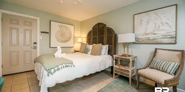 Image 2: Bedroom with light tile patterned flooring and ceiling fan