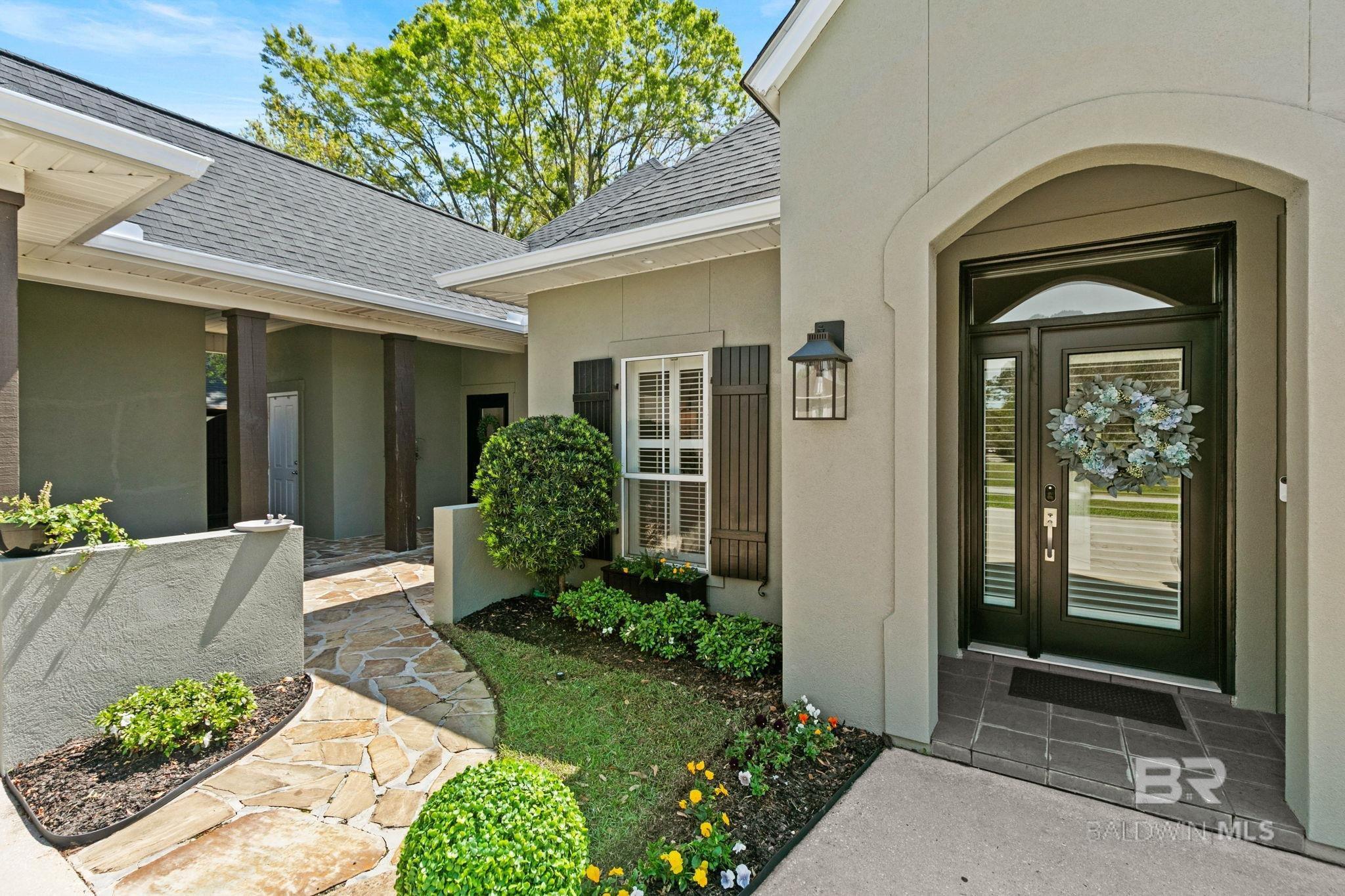 Image 3: Front Entrace with side courtyard