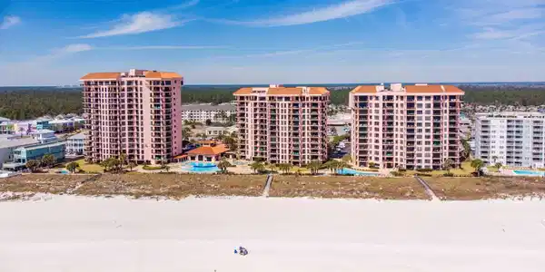 Image 2: Drone / aerial view of expansive beach and apartment complex