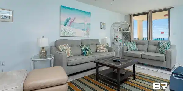 Image 2: Tiled living room with a ceiling fan