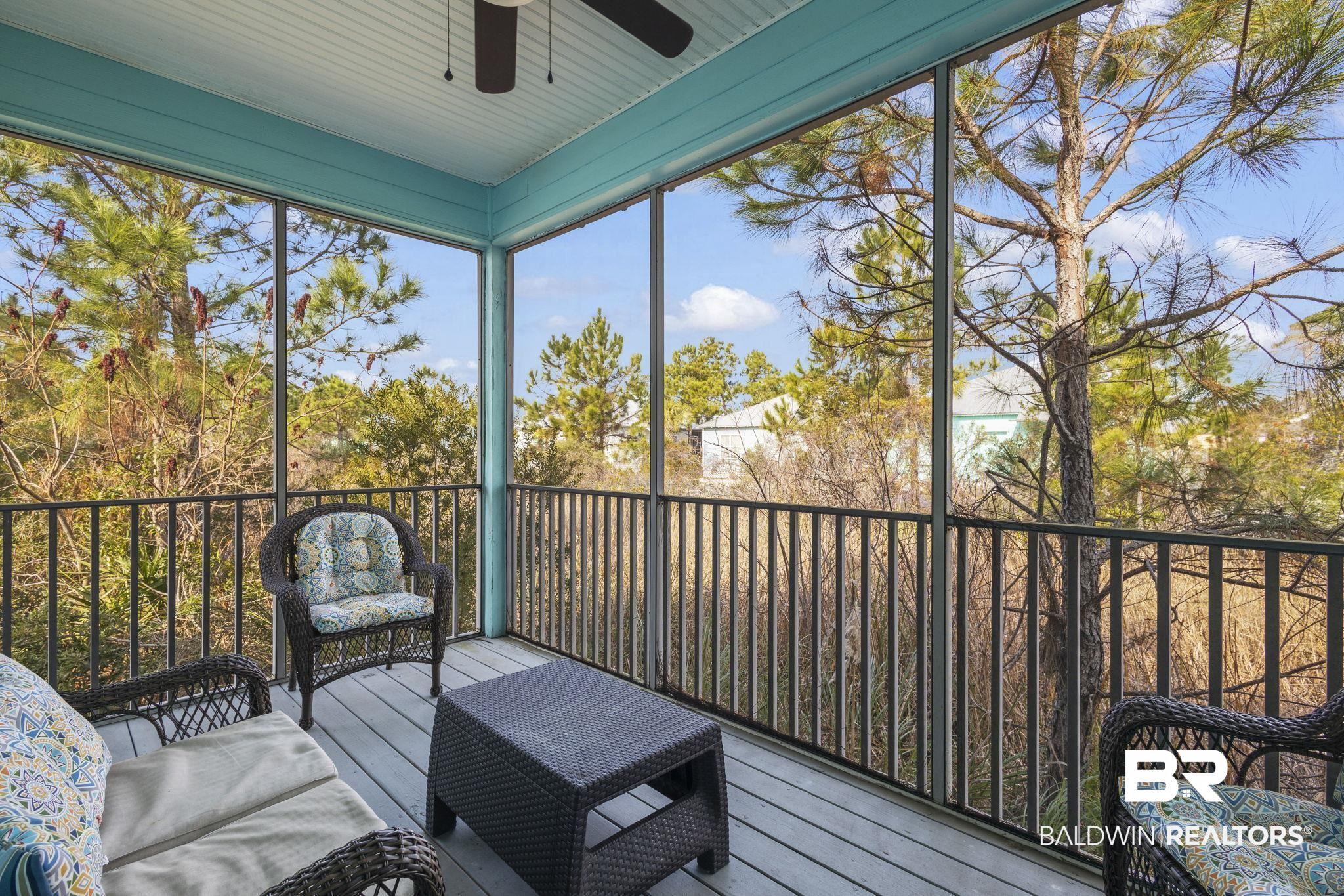 Image 4: Screened Porch with ceiling fan perfect for morning coffee or a relaxing afternoon!