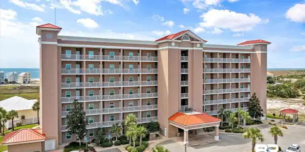 Image 2: View of apartment building / complex with uncovered parking