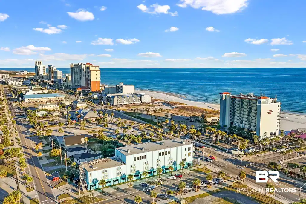 Image 1: View of urban area featuring extended coastline