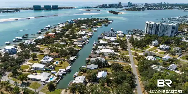 Image 2: View of urban area with a nearby body of water and nearby suburban area