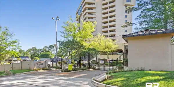 Image 2: View of gates and Loma Alta Towers