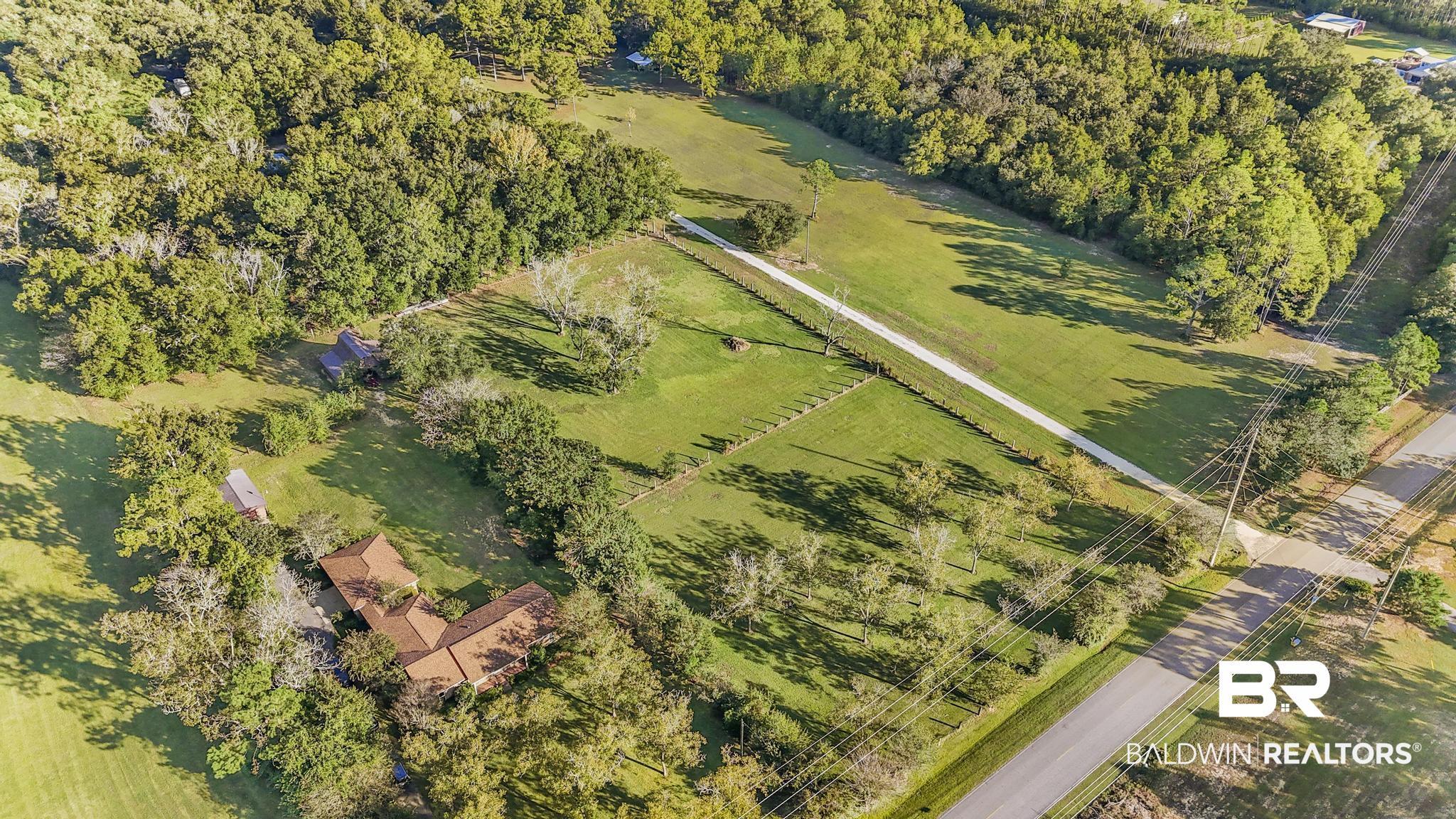 Image 2: Aerial view of sparsely populated area featuring agricultural land