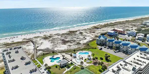 Image 2: Bird's eye view of a pool and unending shoreline