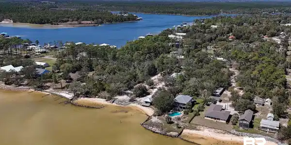 Image 2: Drone / aerial view featuring a water view and a wooded view
