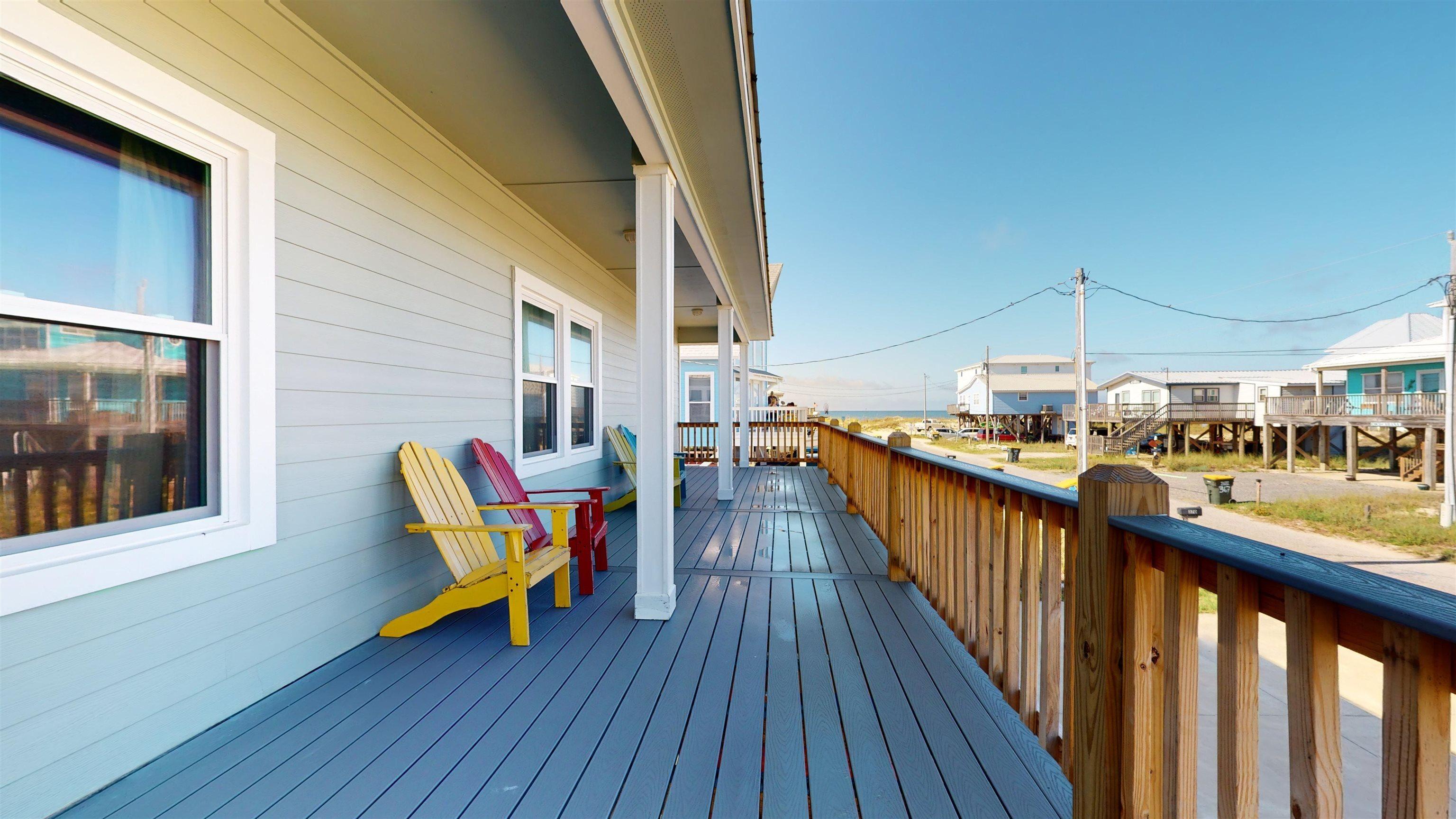 Image 3: Wooden terrace featuring a residential view