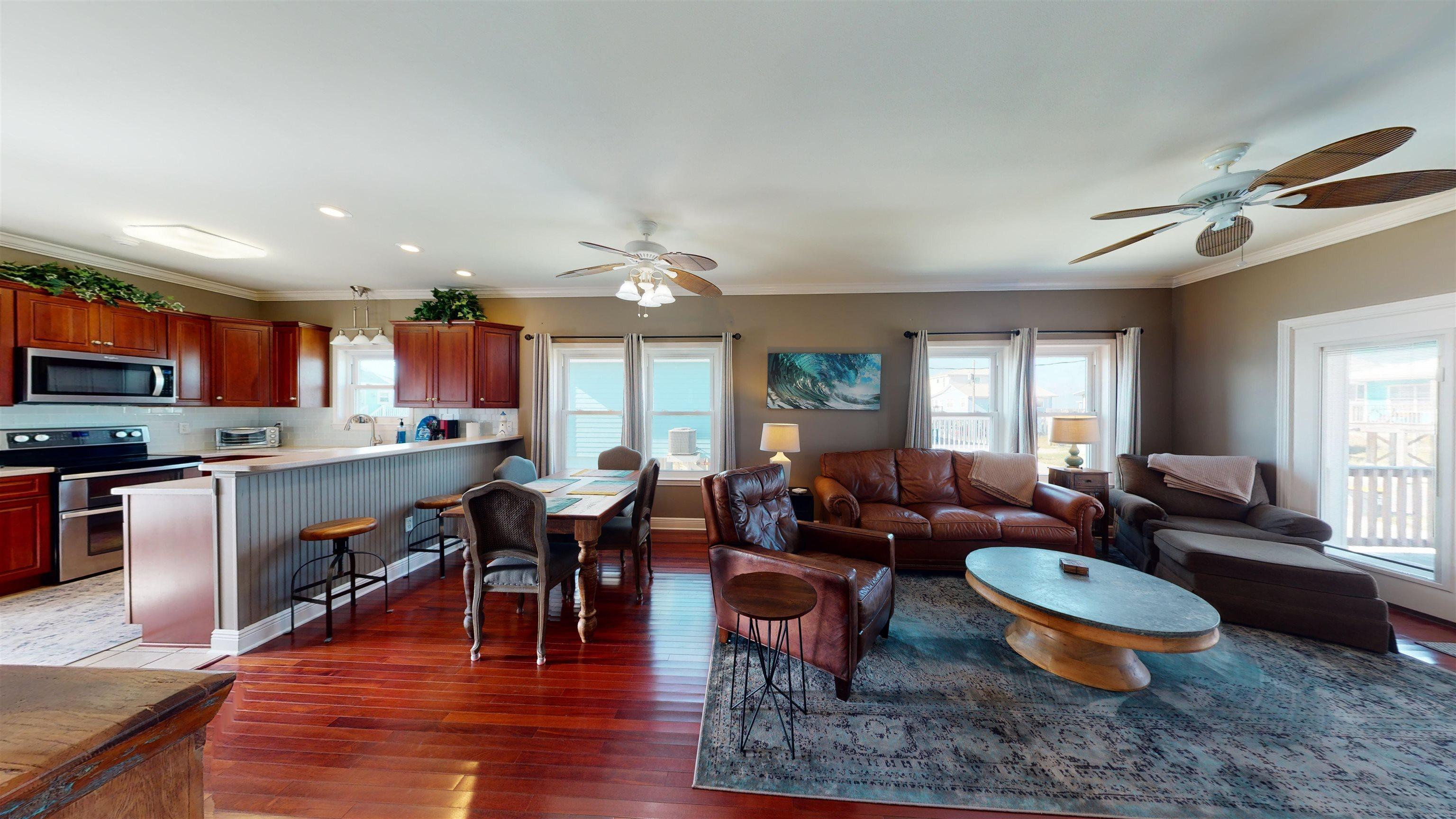 Image 4: Living room with crown molding, a ceiling fan, dark wood finished floors, and recessed lighting