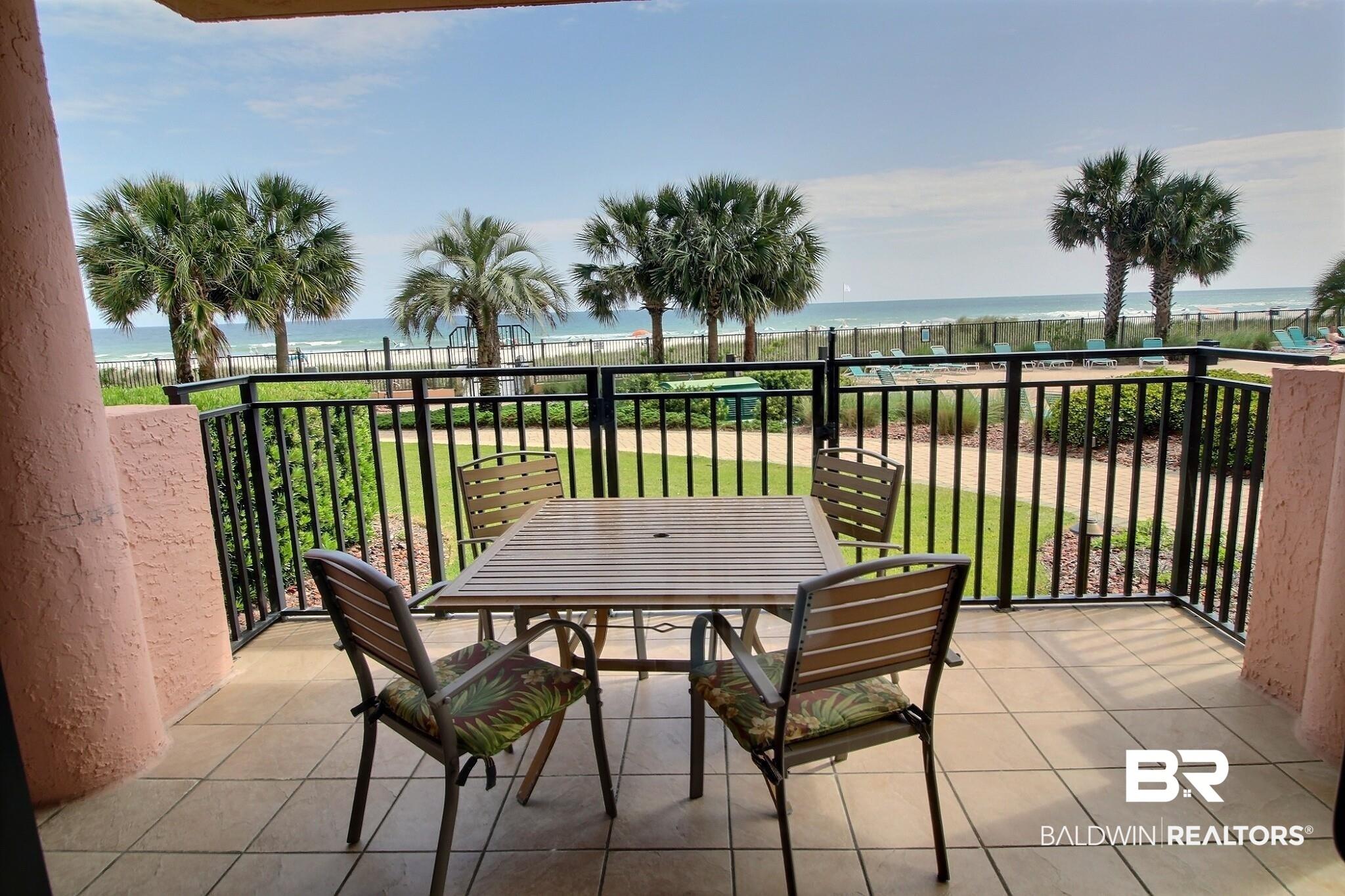 Image 3: Balcony overlooking pool and beach