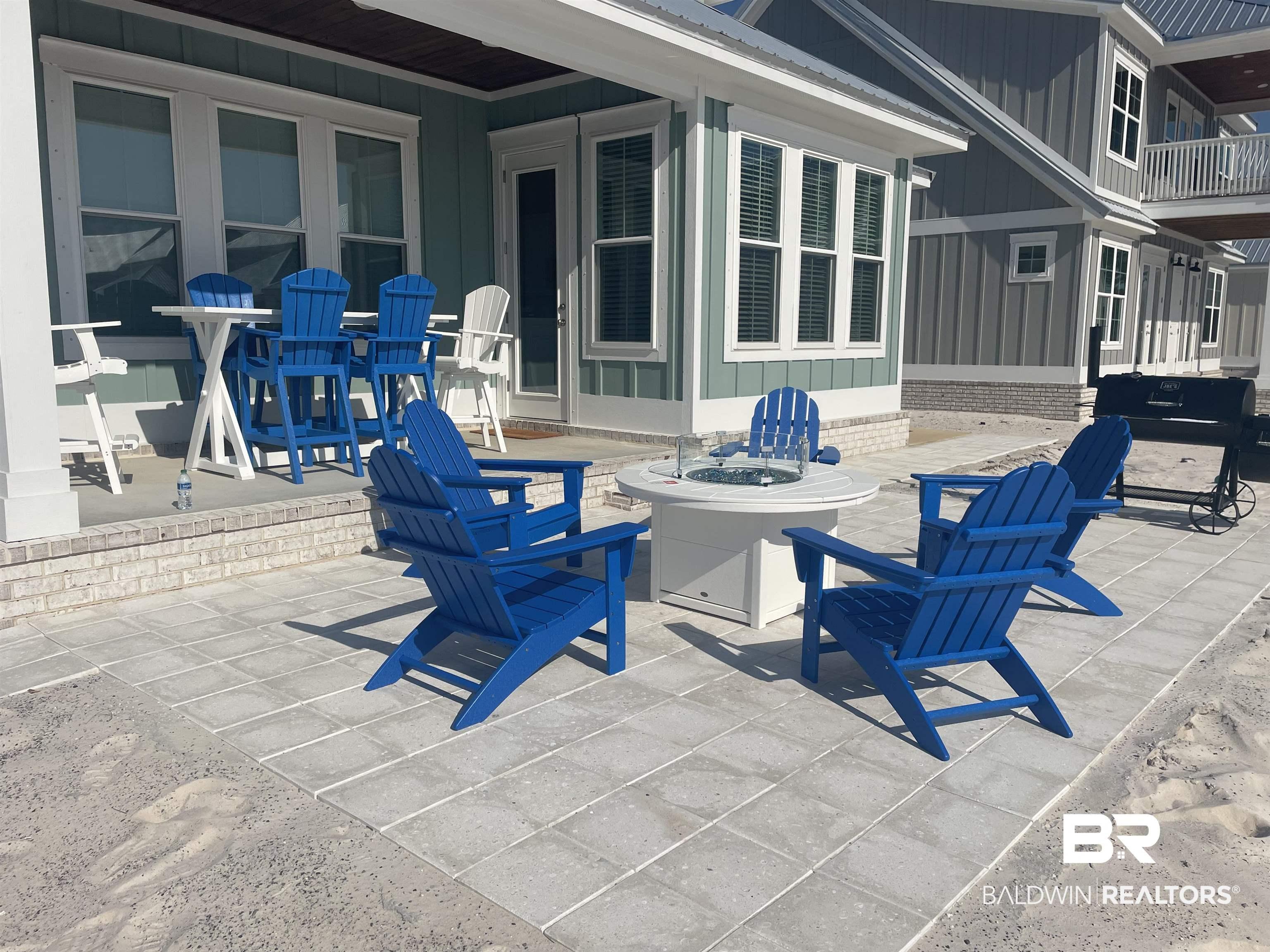 Image 4: View of patio featuring a fire pit