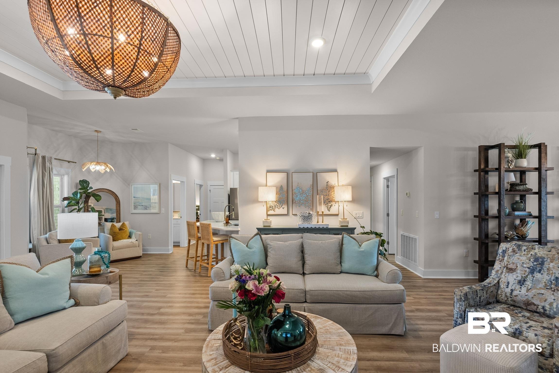 Image 4: Tray ceiling with shiplap accent and recessed lighting