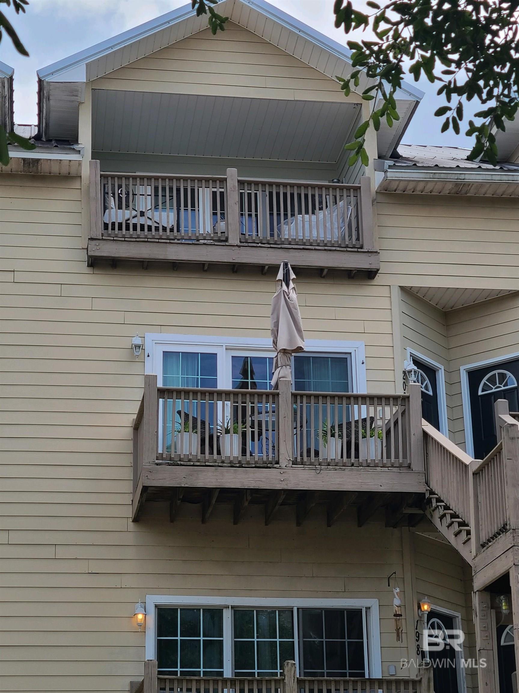Image 2: Rear view of property featuring a balcony