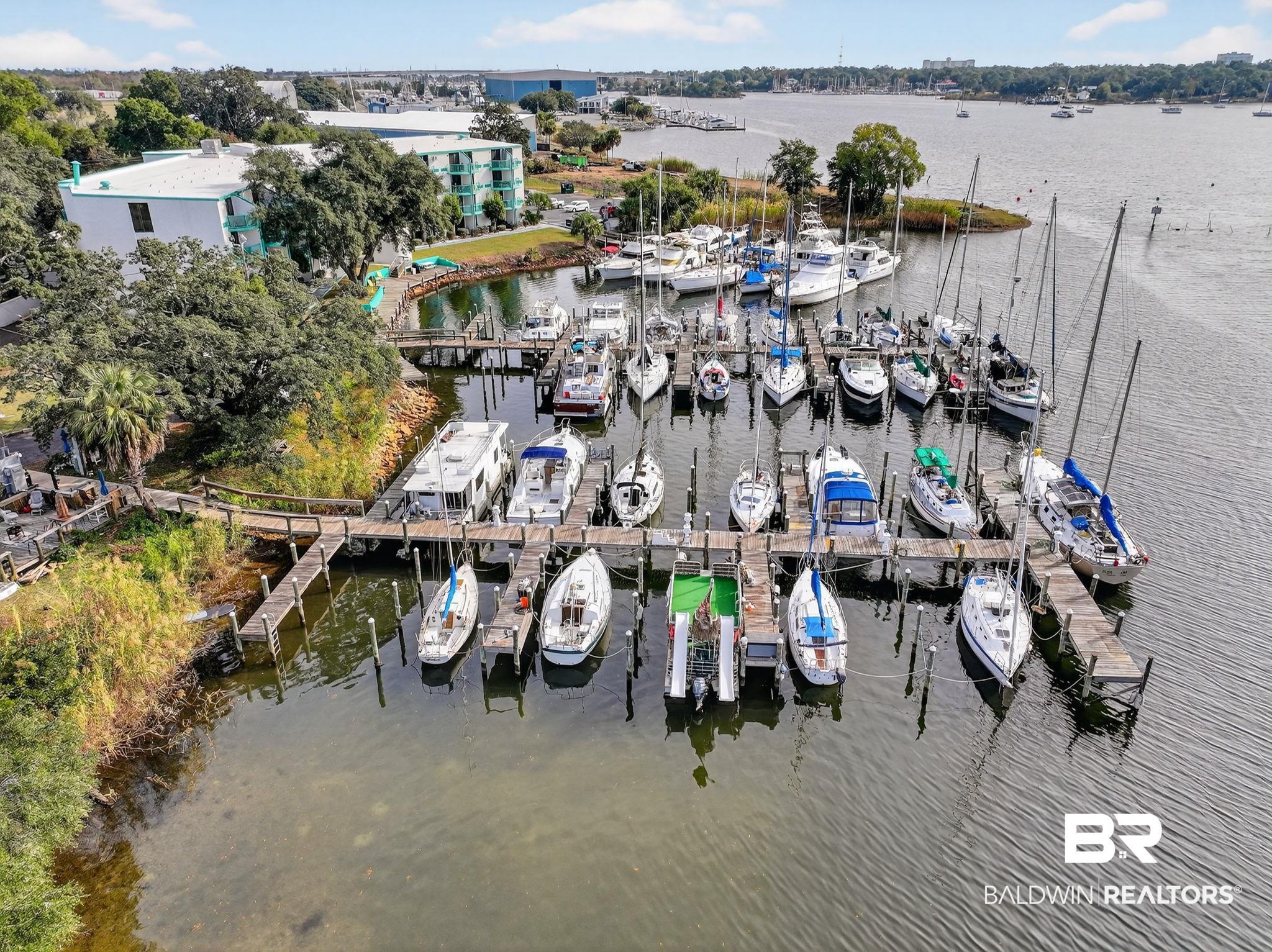 Image 1: Aerial view of a nearby body of water and a marina
