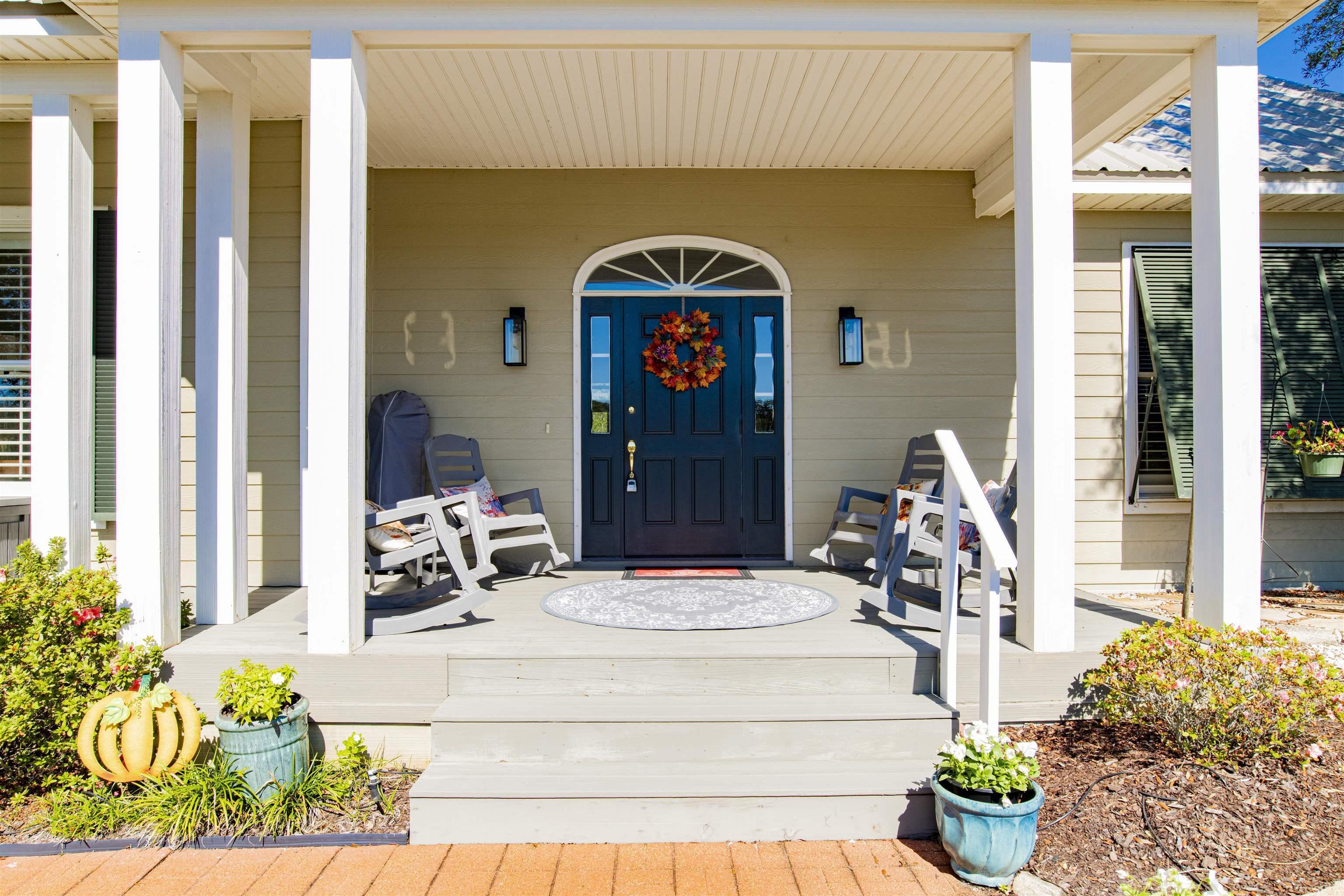 Image 3: Entrance to property with a porch