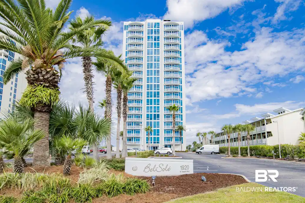 Image 1: Modern high-rise residential building with multiple balconies, a white exterior, and extensive window-to-wall ratios