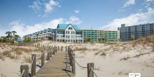 Image 3: Dock area featuring view of water and beach