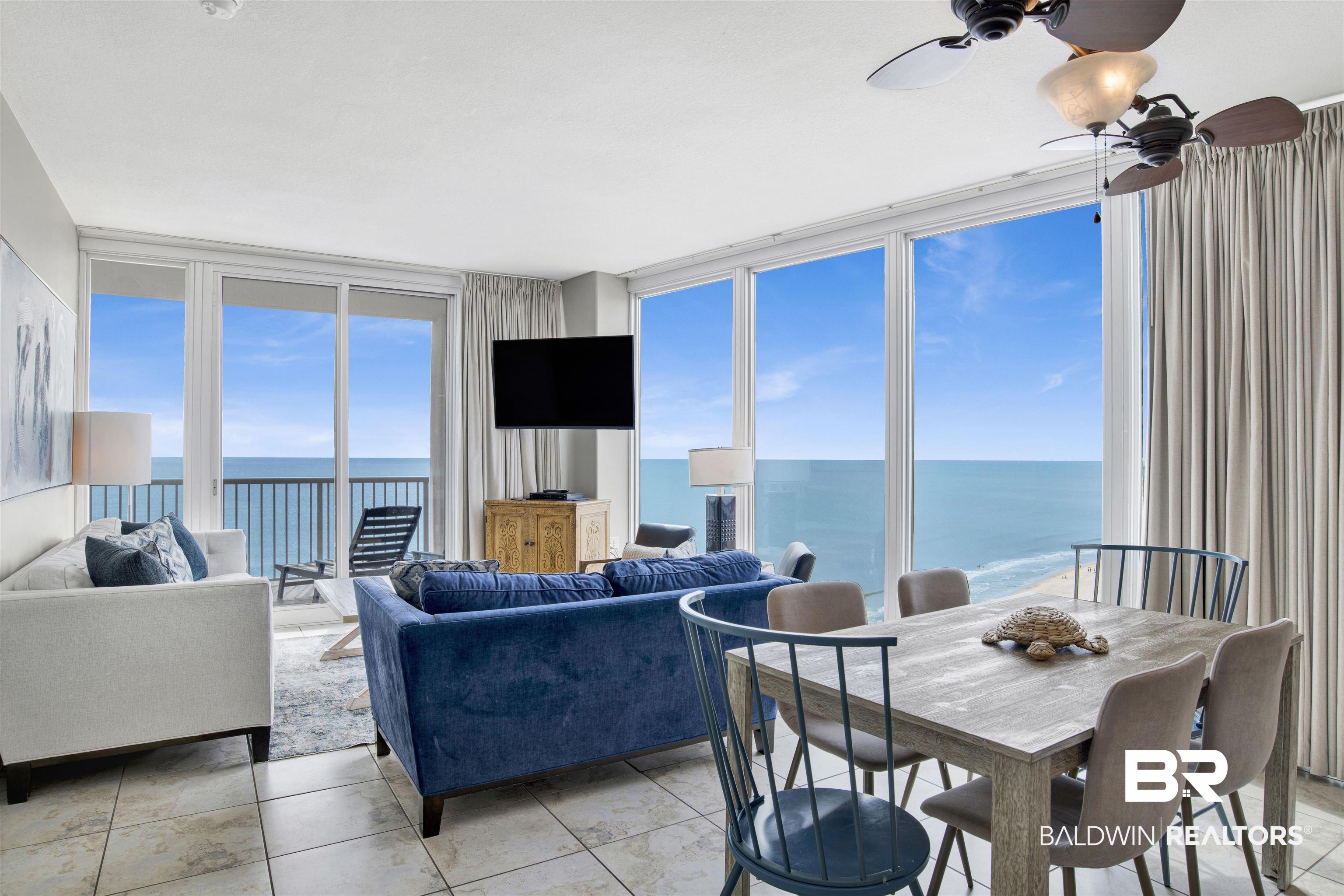 Image 4: Living room with floor to ceiling windows