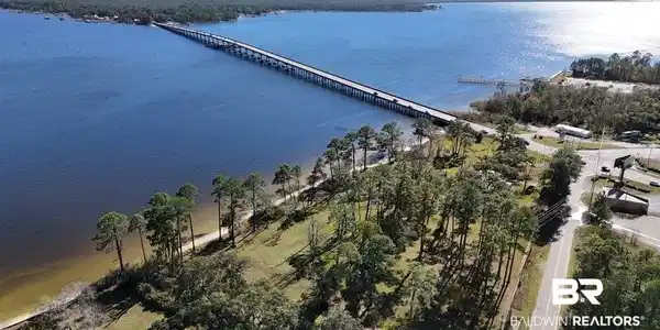 Image 3: Drone / aerial view of a notable bridge and a large body of water