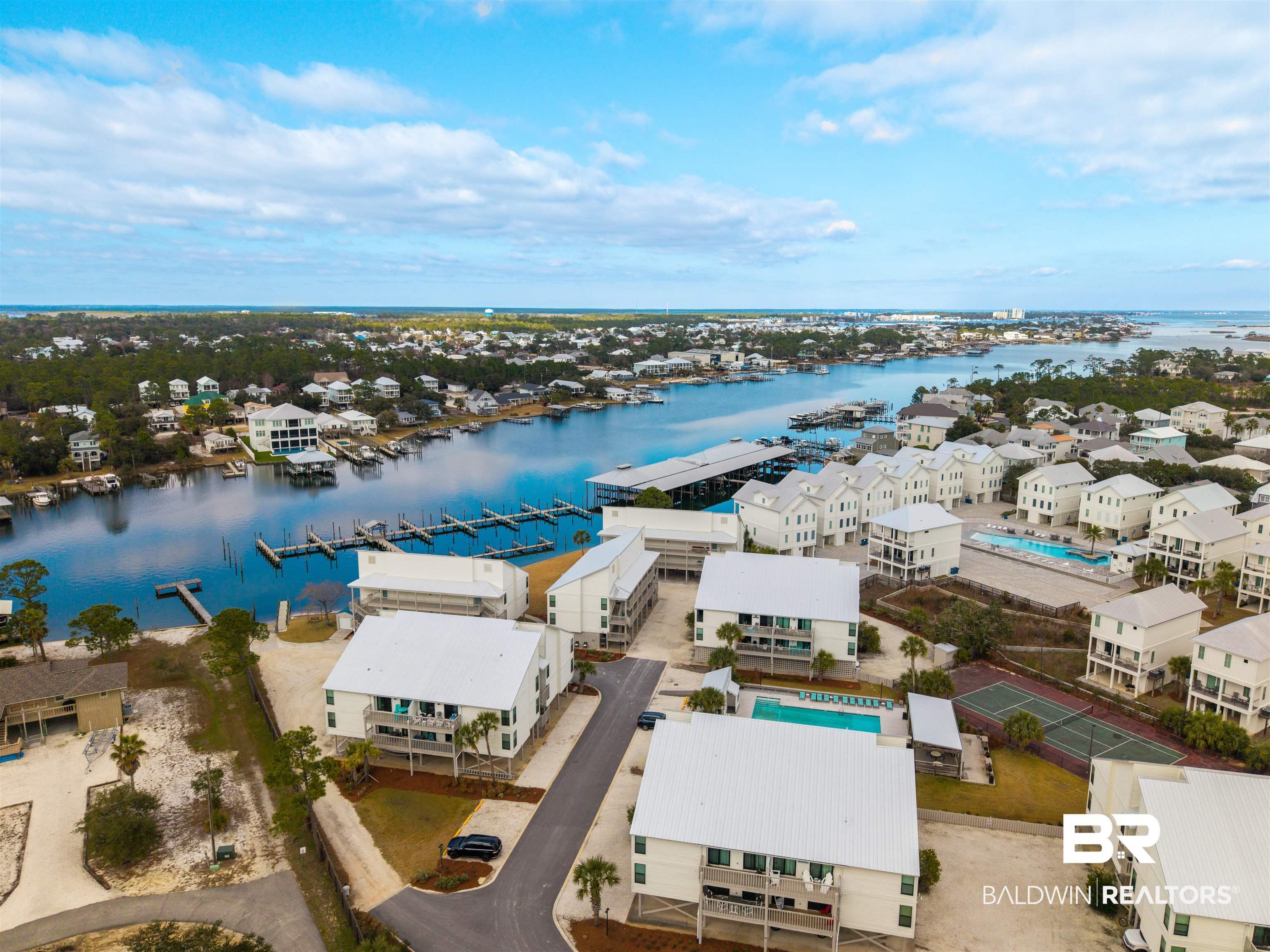 Image 3: Aerial perspective of suburban area with a large body of water