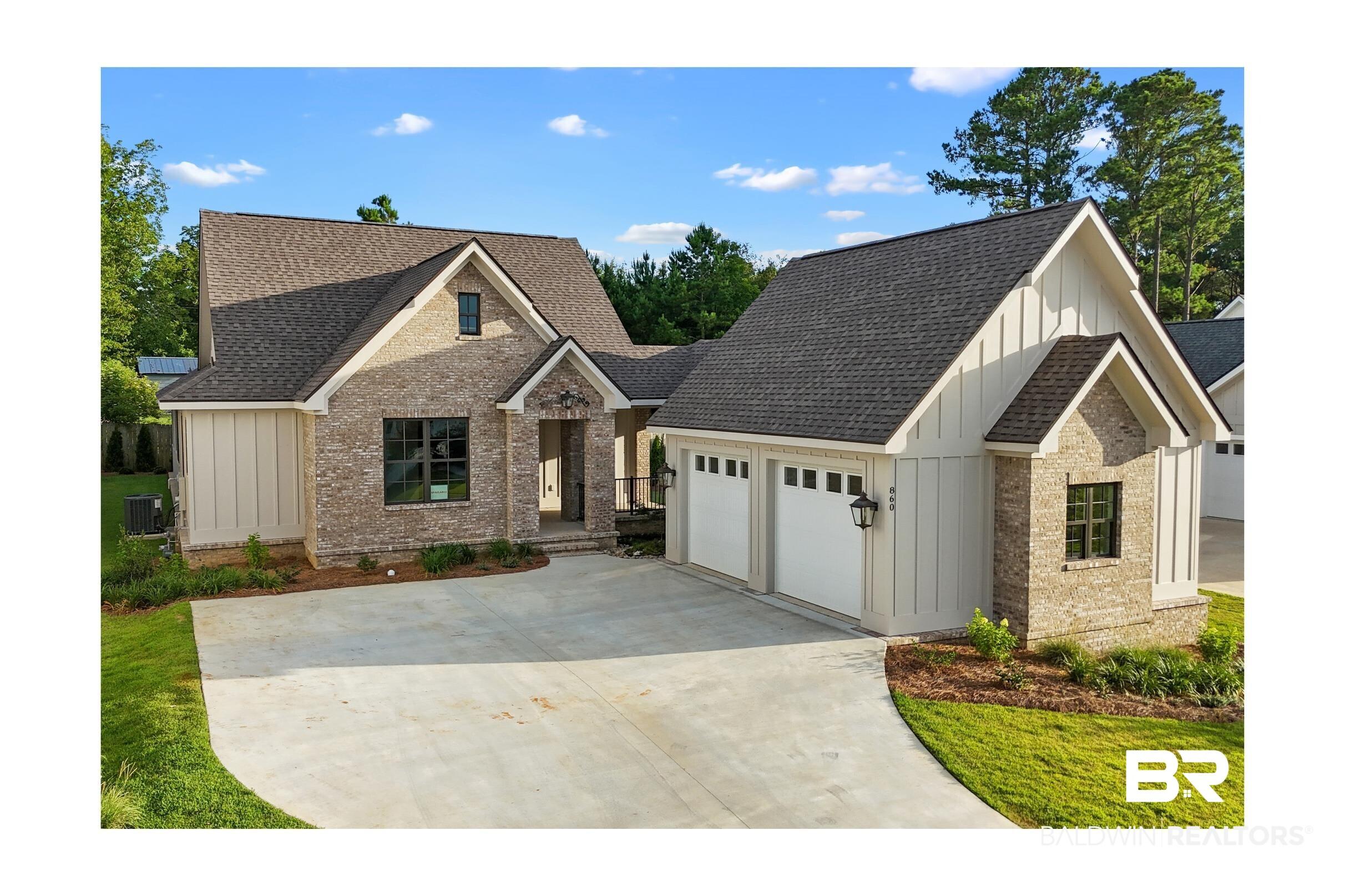 Image 1: Contemporary brick and board-and-batten exterior with a gabled roofline