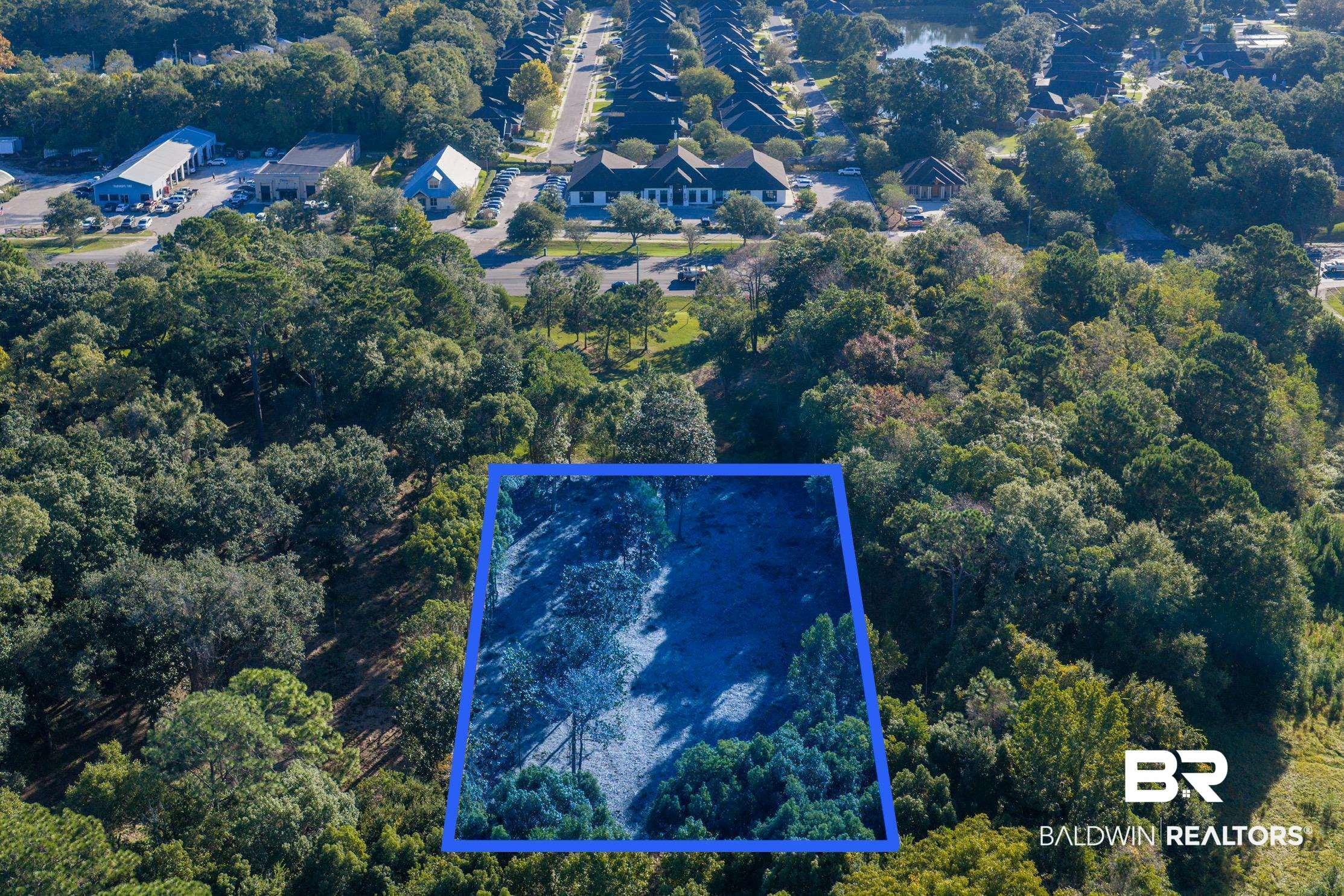 Image 2: Aerial view of property and surrounding area with property parcel outlined