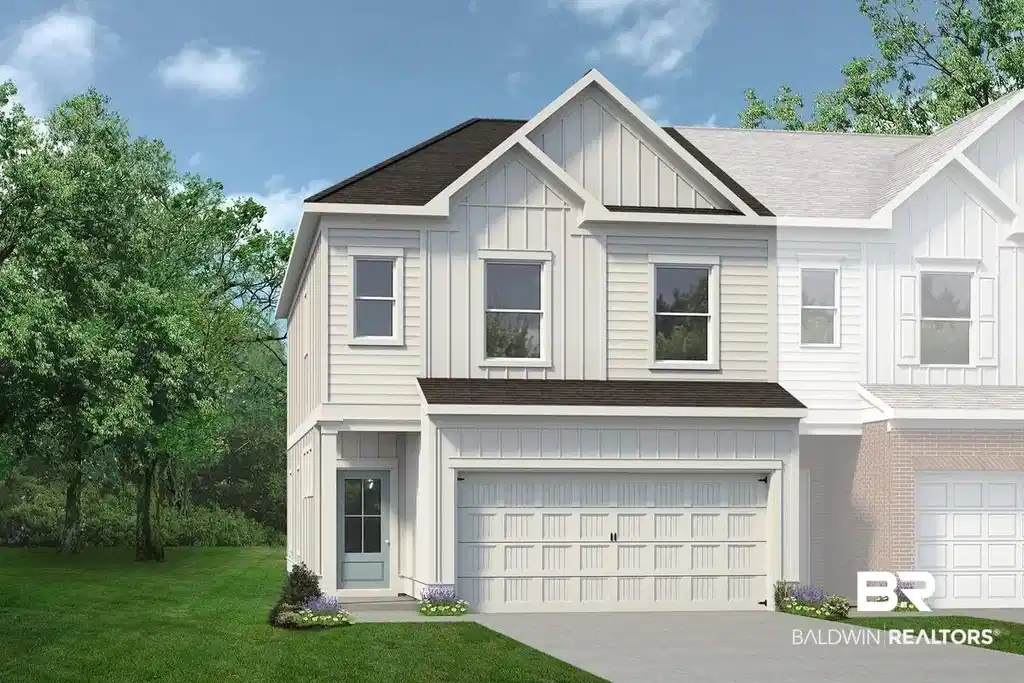 Image 1: Two-story residence featuring light-colored siding, a dark shingle roof, and a panel-style garage door