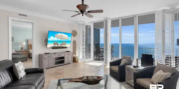 Image 4: Living area featuring expansive windows, ceiling fan, and crown molding