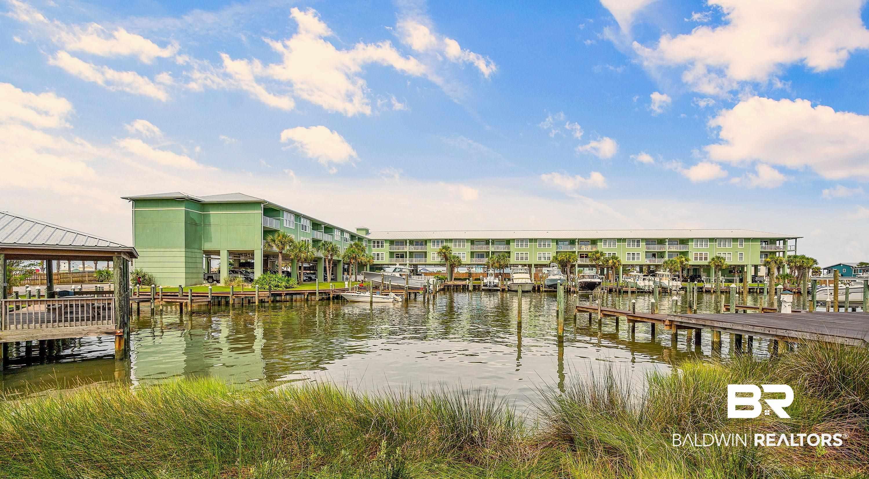 Image 1: Dock featuring a water view and a gazebo