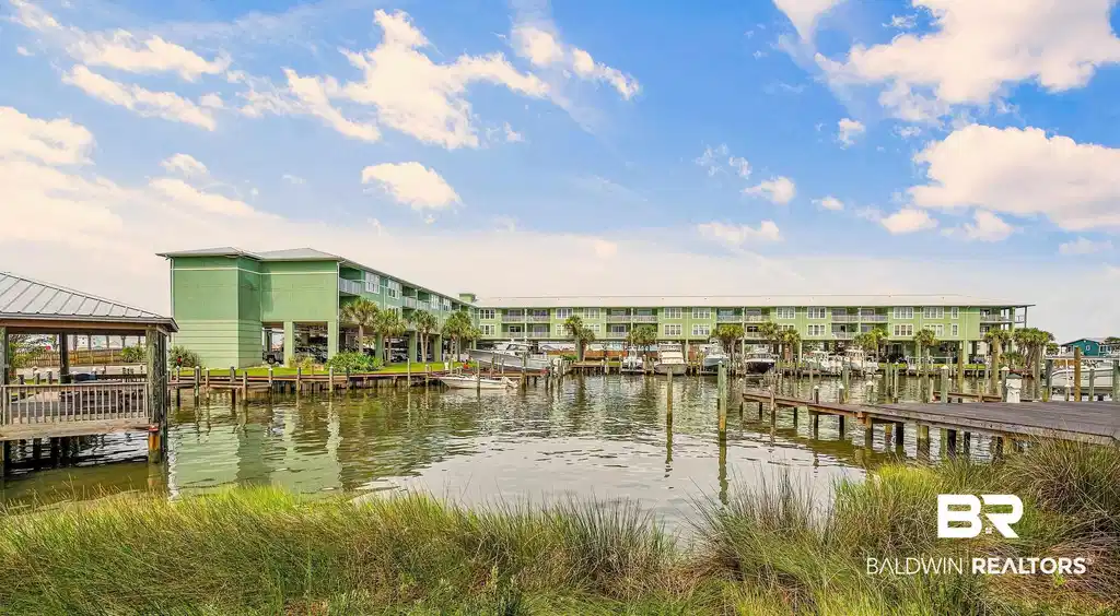 Image 1: Dock featuring a water view and a gazebo
