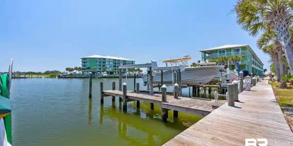 Image 3: Dock area featuring a water view and boat lift