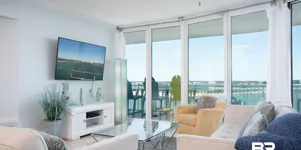 Image 3: Living area featuring floor-to-ceiling glass doors, crown molding, a ceiling fan, and tile flooring
