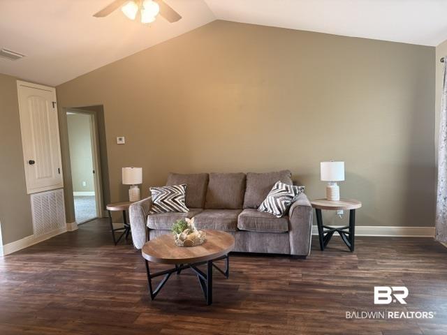 Image 3: Unfurnished living room with dark wood-style flooring, lofted ceiling, and a ceiling fan