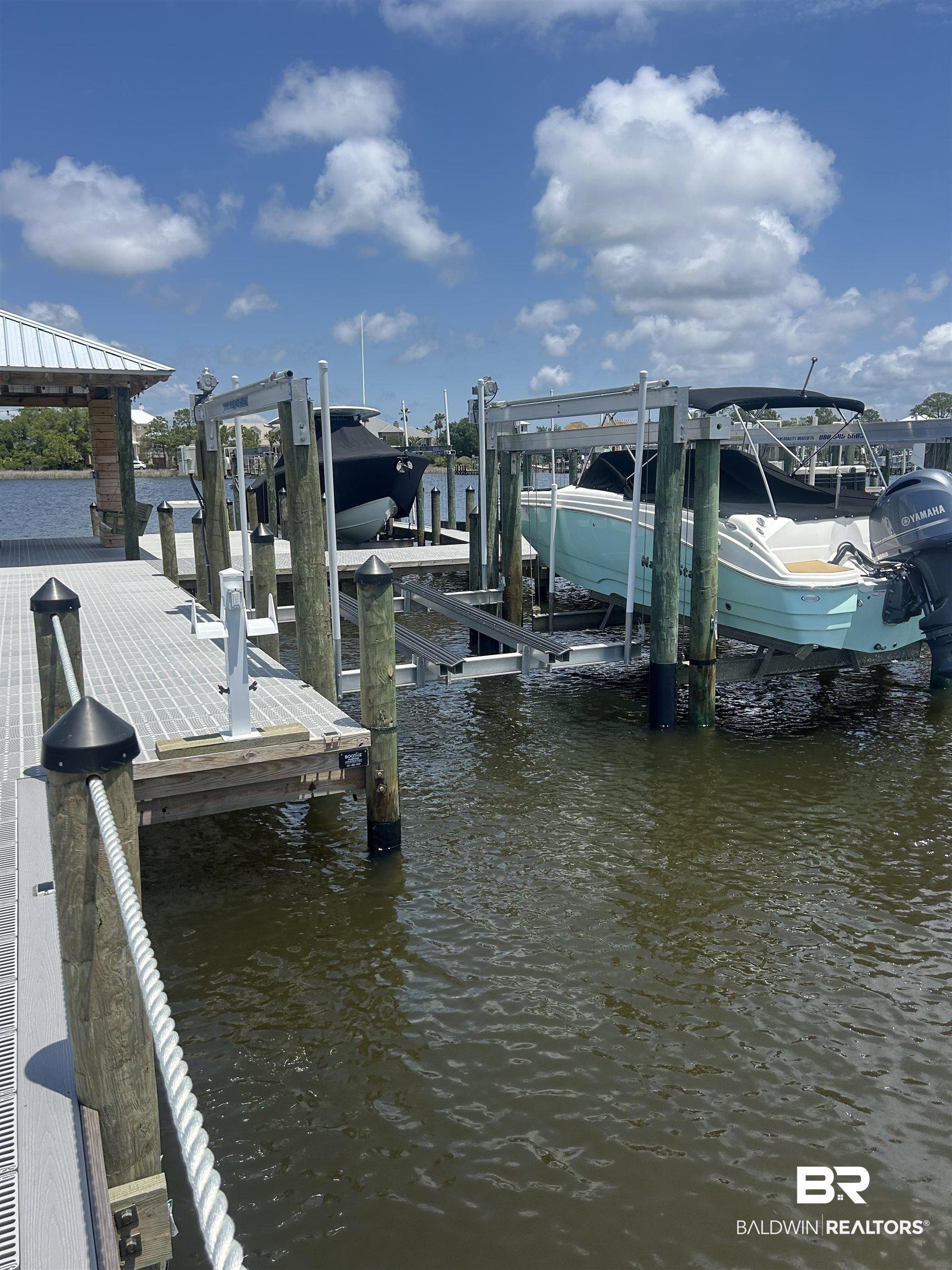 Image 1: Dock with a water view and boat lift