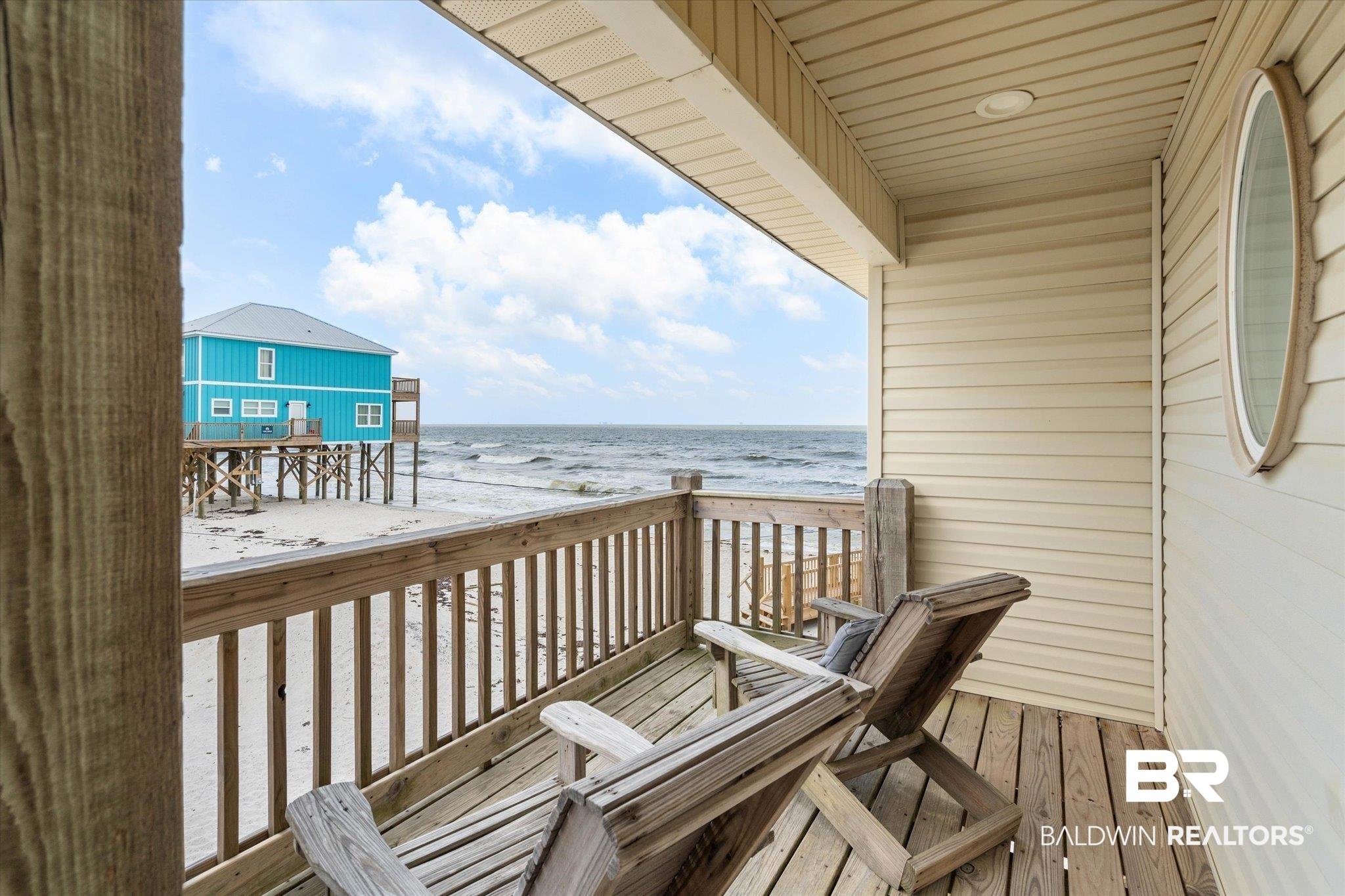Image 3: Balcony with view of water and beach