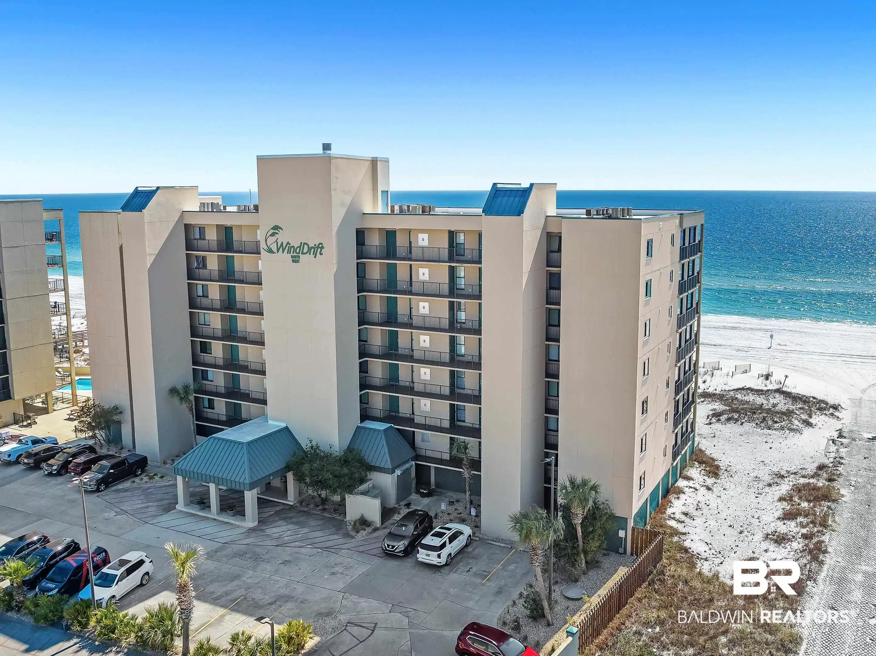 Image 1: View of apartment building / complex featuring a water view and uncovered parking