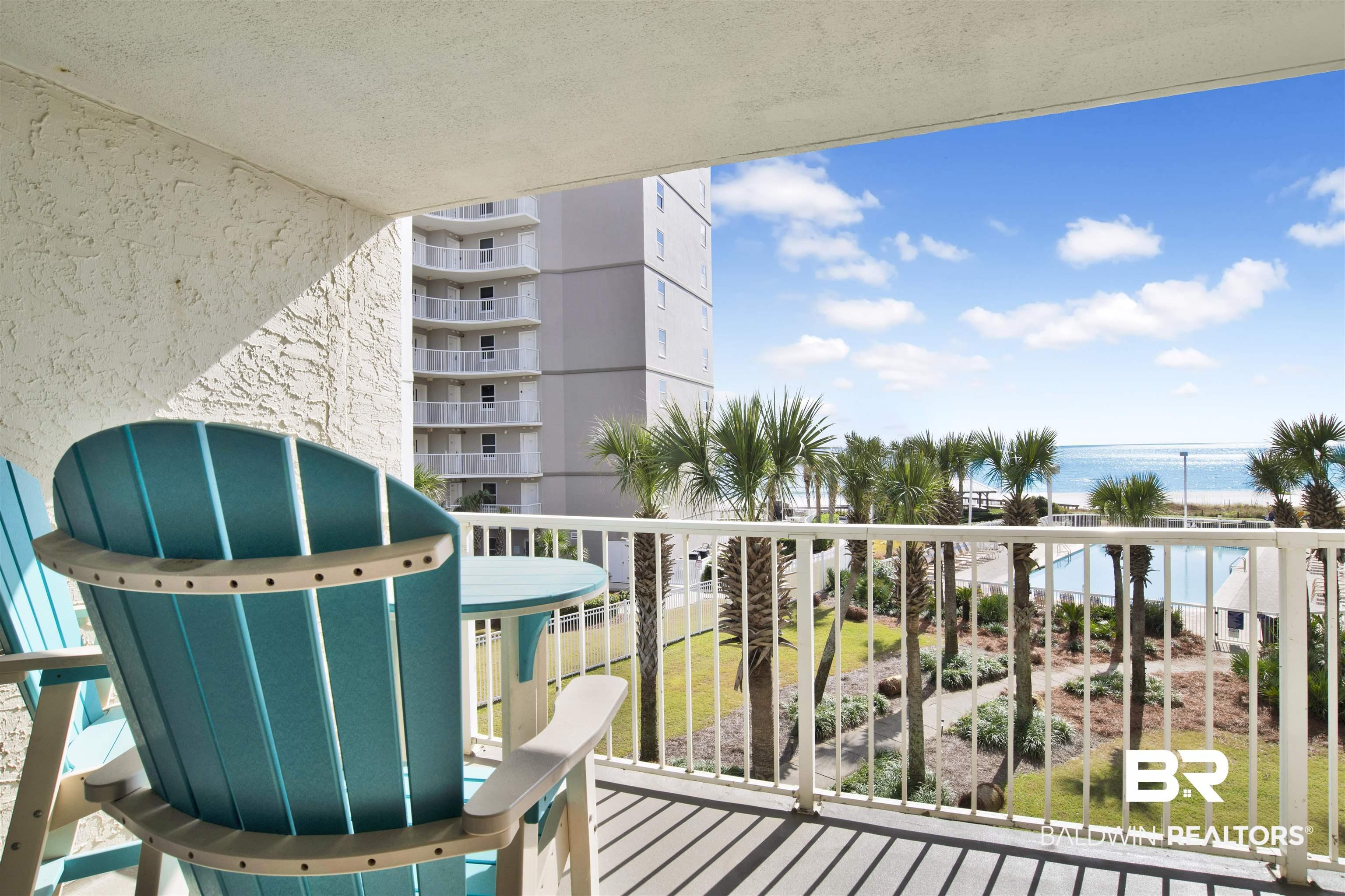 Image 2: Private balcony featuring white railing, textured exterior wall, and outdoor flooring