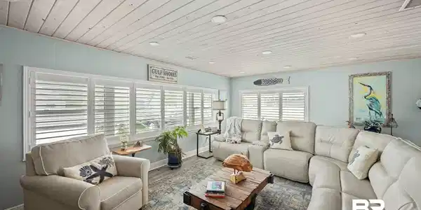Image 3: Living room with wooden ceiling, wood finished floors, and recessed lighting
