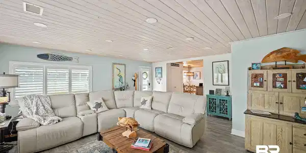 Image 4: Living area featuring wood ceiling and dark wood-style floors