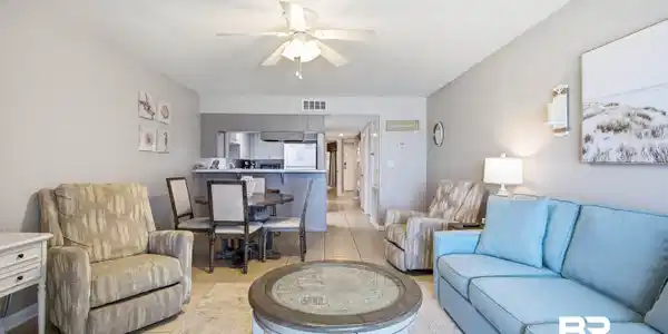 Image 3: Open-concept living space with tile flooring, a ceiling fan, and recessed lighting