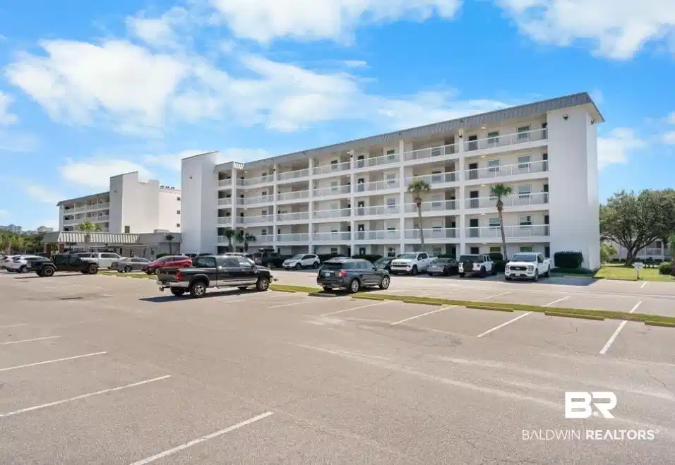 Image 1: View of apartment building / complex featuring uncovered parking