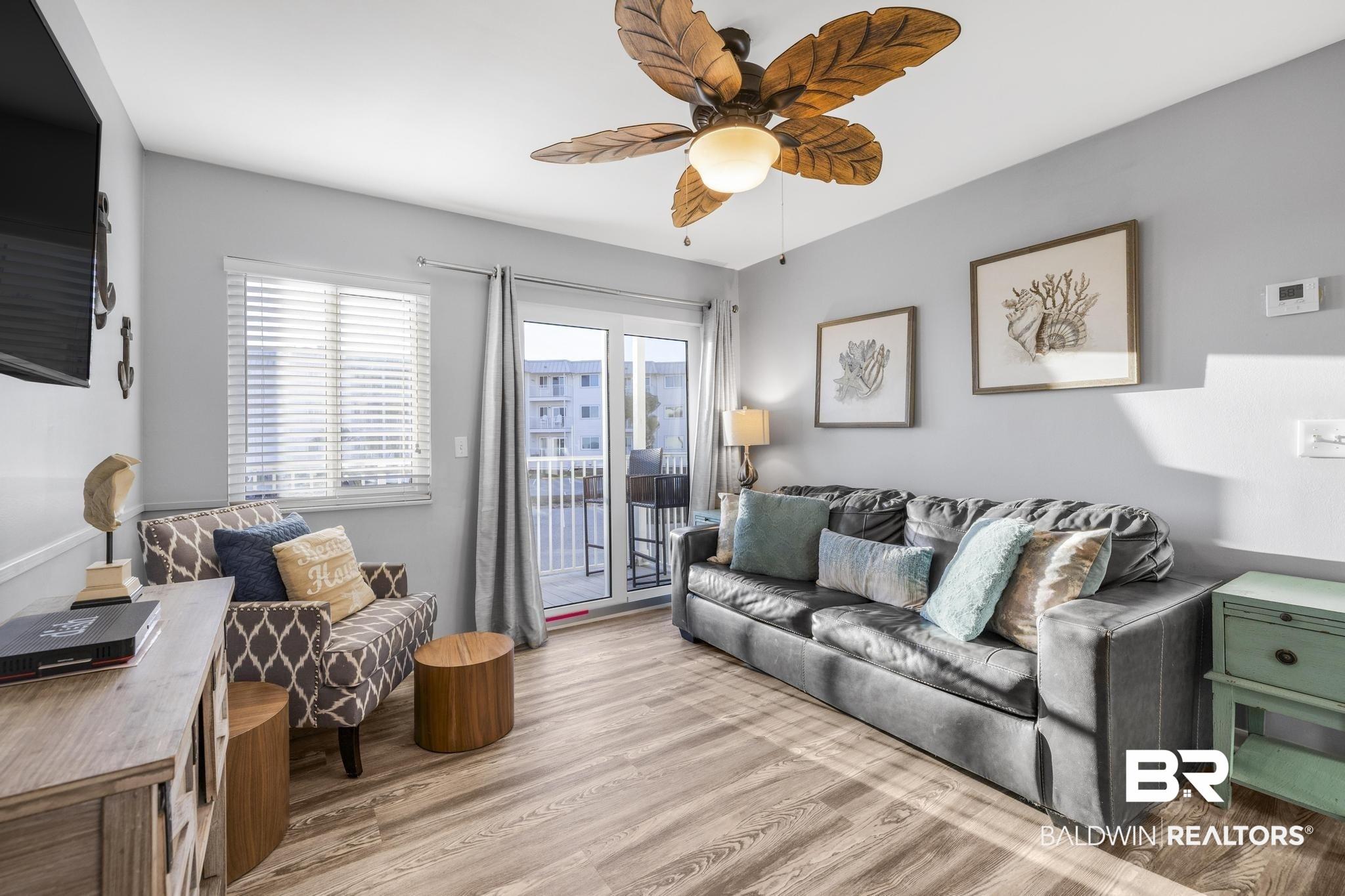 Image 2: Living room featuring wood finished floors and a ceiling fan