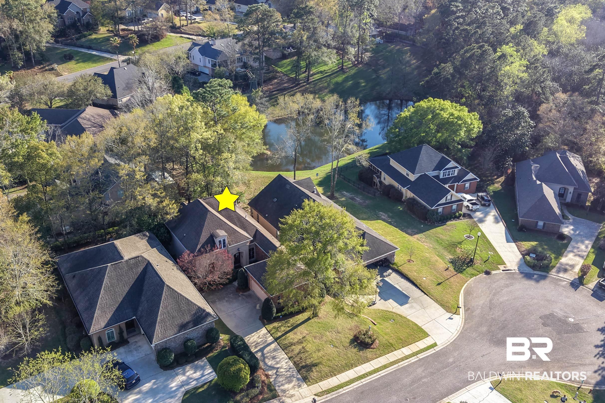 Image 3: Aerial perspective of suburban area with a nearby body of water
