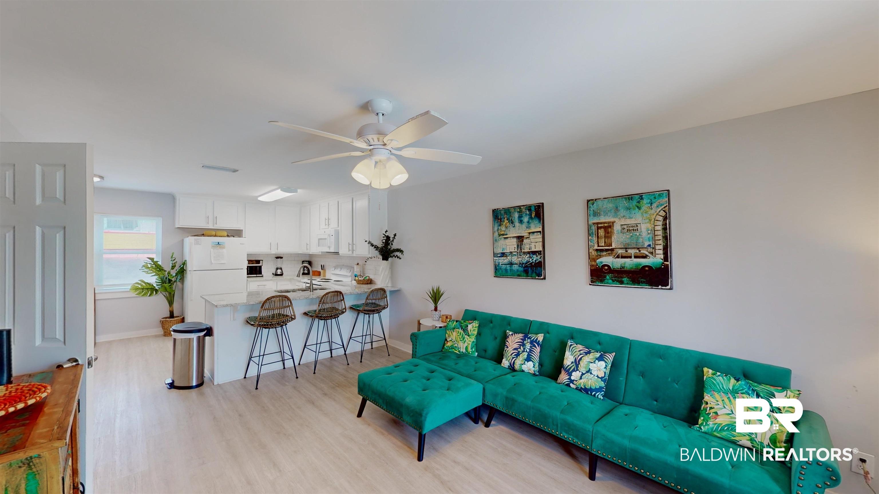 Image 3: Living room featuring light wood-type flooring and ceiling fan