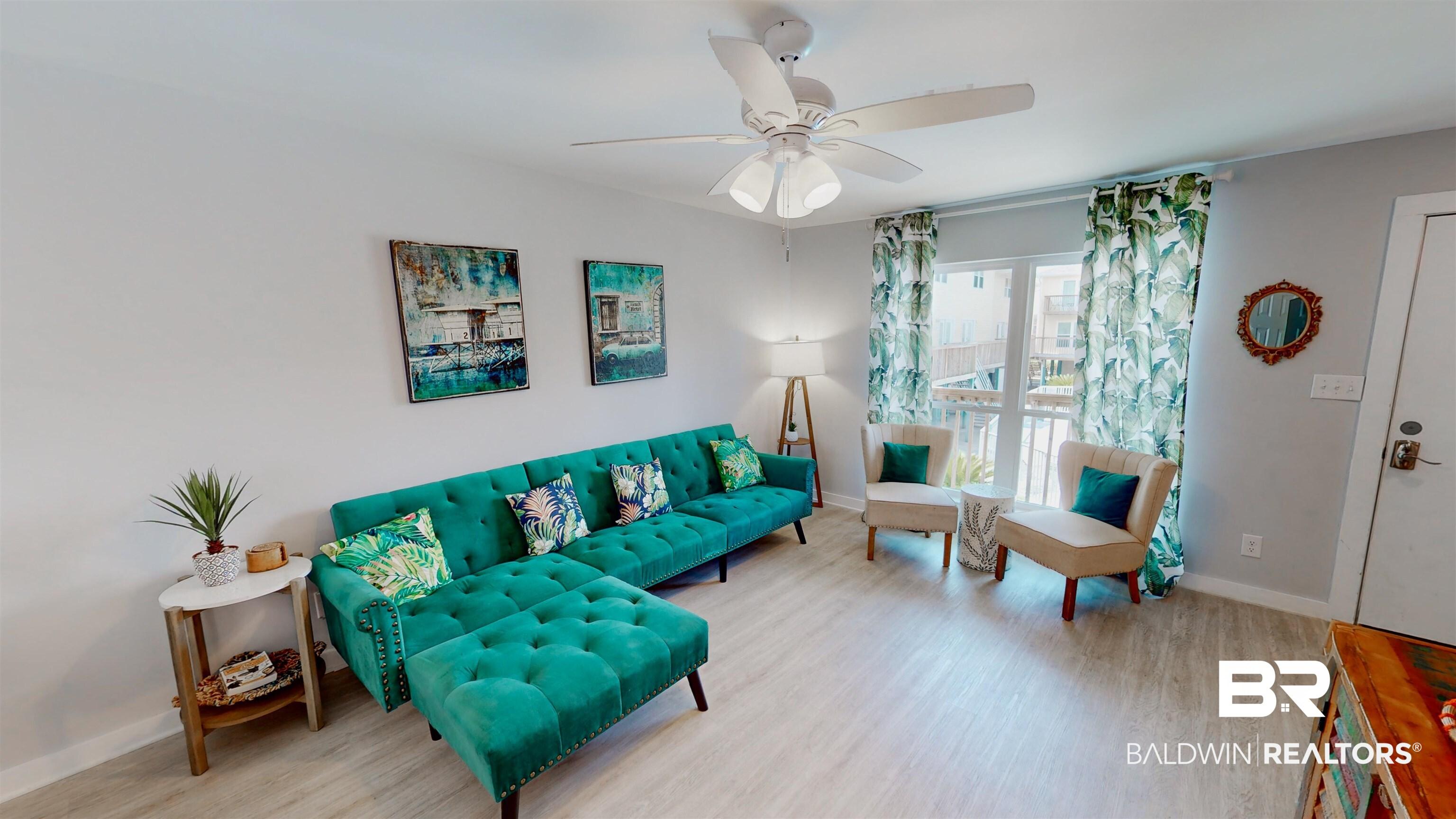 Image 4: Living room with wood finished floors and ceiling fan
