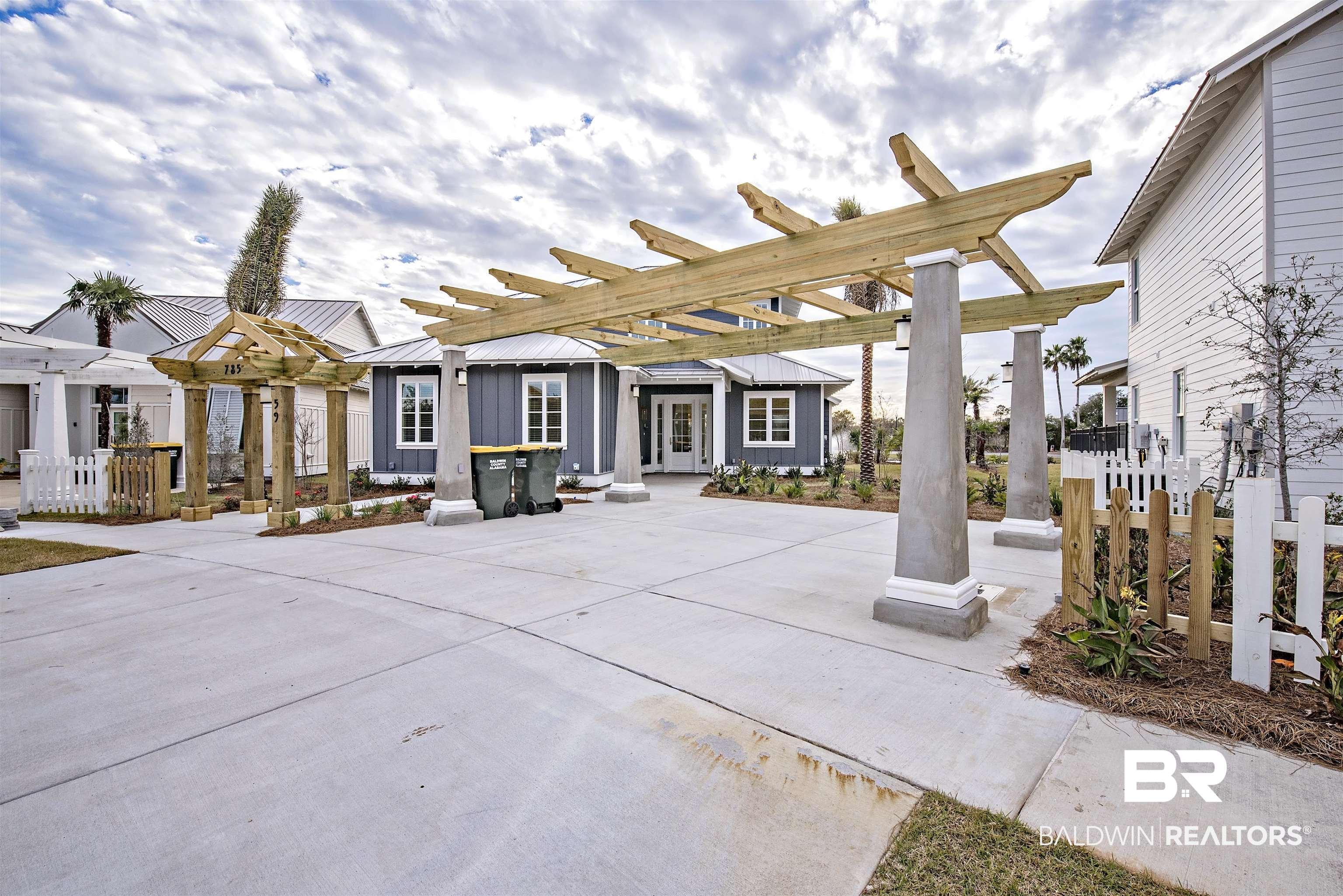 Image 1: View of patio with a pergola
